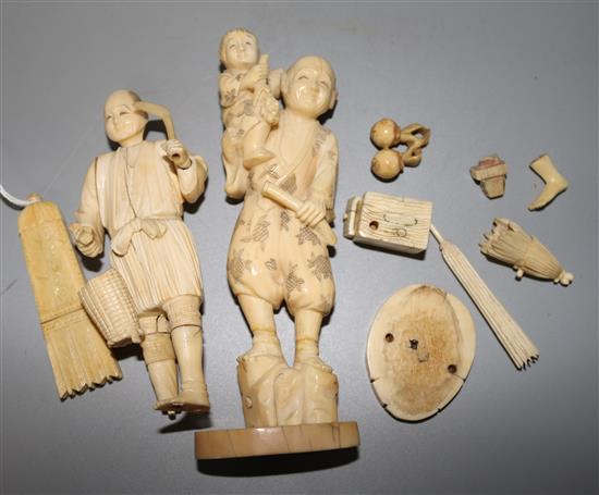 A 19th century ivory quiver needle case and two Japanese ivory figures